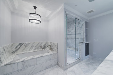 Example of a large transitional master white tile and stone tile marble floor bathroom design in Chicago with an undermount sink, flat-panel cabinets, dark wood cabinets, marble countertops, an undermount tub, a one-piece toilet and gray walls