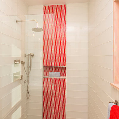 Inspiration for a small modern master white tile and glass tile concrete floor and gray floor bathroom remodel in Denver with flat-panel cabinets, red cabinets, a wall-mount toilet, white walls, a drop-in sink and solid surface countertops
