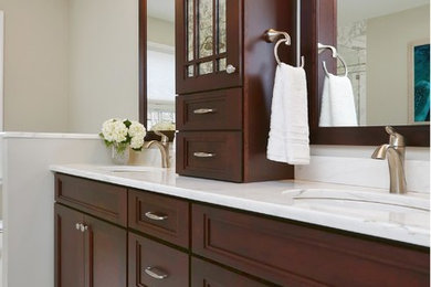 Medium sized classic ensuite bathroom in Philadelphia with flat-panel cabinets, dark wood cabinets, a freestanding bath, a corner shower, a two-piece toilet, white tiles, marble tiles, beige walls, marble flooring, a submerged sink and marble worktops.