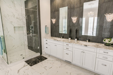 Inspiration for a large classic ensuite bathroom in Dallas with white cabinets, a freestanding bath, a two-piece toilet, white tiles, stone tiles, white walls, marble flooring, a submerged sink, marble worktops, raised-panel cabinets and a built-in shower.