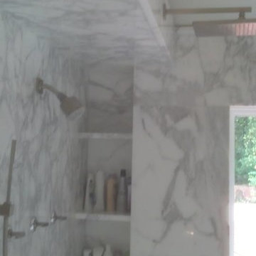 Calcutta Gold Marble Bathroom and Closet