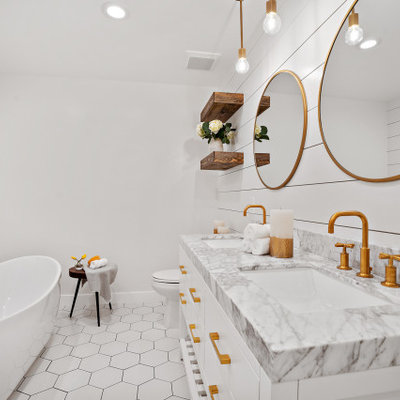 Example of a large transitional master porcelain tile, white floor, double-sink and shiplap wall freestanding bathtub design in San Francisco with furniture-like cabinets, white cabinets, white walls, an undermount sink, gray countertops, a niche and a built-in vanity