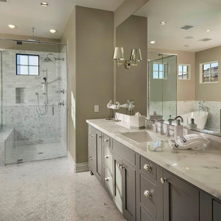 Transitional white tile freestanding bathtub photo in Phoenix with gray cabinets, marble countertops, shaker cabinets, gray walls and an undermount sink