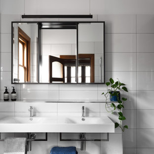 Transitional master bathroom in Melbourne with flat-panel cabinets, white cabinets, white tile, white walls, an integrated sink, multi-coloured floor, white benchtops, a double vanity and a floating vanity.