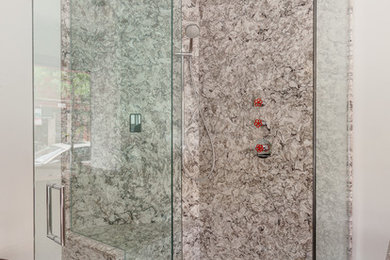 Inspiration for a large contemporary master stone slab corner shower remodel in Chicago with quartz countertops and white walls