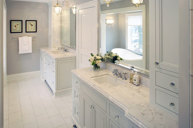 Inspiration for a transitional master white tile and stone tile marble floor bathroom remodel in Detroit with an undermount sink, beaded inset cabinets, white cabinets, quartzite countertops and gray walls