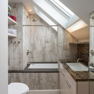 Inspiration for a small contemporary beige tile and brown tile pebble tile floor bathroom remodel in Boston with flat-panel cabinets, beige cabinets, an undermount tub, white walls and an undermount sink