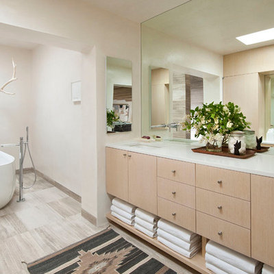Freestanding bathtub - southwestern freestanding bathtub idea in Albuquerque with white countertops