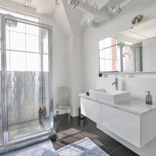 Inspiration for a mid-sized industrial 3/4 bathroom in Austin with flat-panel cabinets, white cabinets, a corner shower, metal tile, white walls, a vessel sink, a hinged shower door and brown floor.