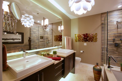 Large modern ensuite bathroom in Chicago with flat-panel cabinets, dark wood cabinets, a submerged bath, a corner shower, a two-piece toilet, brown walls, a vessel sink and a hinged door.