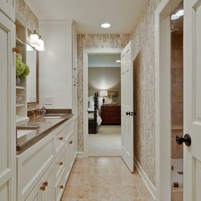 Example of a classic beige tile alcove shower design in Nashville with an undermount sink, white cabinets and recessed-panel cabinets