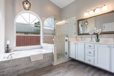 Bathroom - transitional master multicolored tile and porcelain tile gray floor bathroom idea in Jacksonville with white cabinets, gray walls, an undermount sink and a hinged shower door