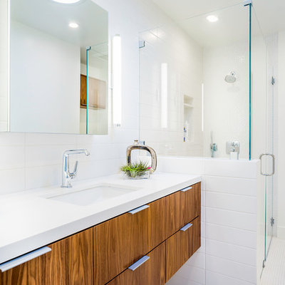Corner shower - large contemporary white tile mosaic tile floor corner shower idea in Los Angeles with an undermount sink, flat-panel cabinets, medium tone wood cabinets and white walls