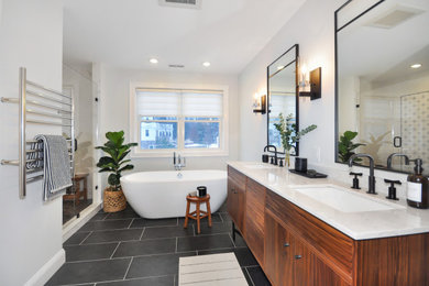 Example of a mid-sized transitional master white tile and marble tile porcelain tile and gray floor alcove shower design in Boston with furniture-like cabinets, white cabinets, a one-piece toilet, gray walls, an undermount sink, quartz countertops and a hinged shower door