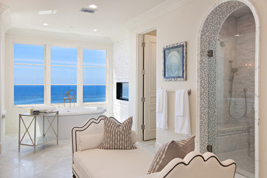 Example of a large beach style master gray tile, white tile and stone tile marble floor and gray floor bathroom design in San Diego with a two-piece toilet, beige walls and a hinged shower door
