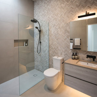 Inspiration for a small contemporary master bathroom in Melbourne with light wood cabinets, an open shower, multi-coloured tile, mosaic tile, grey walls, porcelain floors, an undermount sink, engineered quartz benchtops, grey floor, an open shower, grey benchtops and a two-piece toilet.