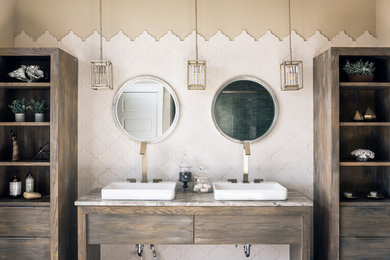 Example of a large minimalist master white tile and ceramic tile ceramic tile and gray floor bathroom design in Other with flat-panel cabinets, distressed cabinets, a one-piece toilet, beige walls, an undermount sink, granite countertops and a hinged shower door