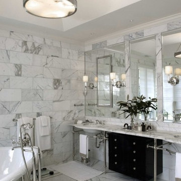 Carrera Marble Master Bathroom with Free Standing Tub and Furniture Vanity