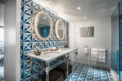 Example of a mid-sized beach style master blue tile and ceramic tile ceramic tile and blue floor bathroom design in Miami with open cabinets, a two-piece toilet, gray walls, an undermount sink, marble countertops and gray countertops