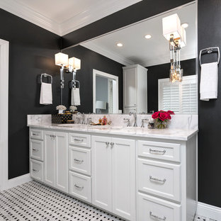 Bathroom - mid-sized transitional master black and white tile and mosaic tile mosaic tile floor bathroom idea in Miami with flat-panel cabinets, white cabinets, a two-piece toilet, black walls, an undermount sink and marble countertops
