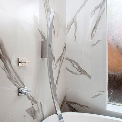 Example of a large minimalist master white tile and marble tile slate floor and gray floor bathroom design in Dallas with flat-panel cabinets, white cabinets, white walls, an undermount sink, marble countertops, a hinged shower door and gray countertops