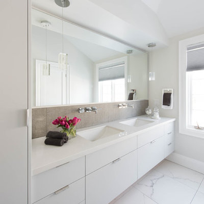 Inspiration for a mid-sized contemporary master gray tile and porcelain tile porcelain tile bathroom remodel in Toronto with an undermount sink, flat-panel cabinets, white cabinets, quartzite countertops, white walls and white countertops