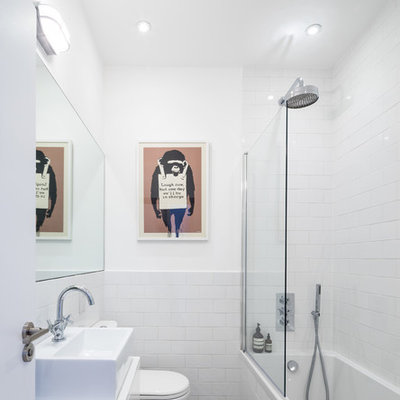 Bathroom - contemporary white tile and subway tile multicolored floor bathroom idea in London with a vessel sink, flat-panel cabinets and white cabinets