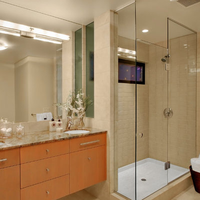 Inspiration for a contemporary beige tile corner shower remodel in Seattle