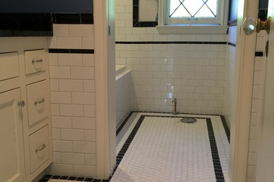 Inspiration for a mid-sized contemporary 3/4 black and white tile and subway tile mosaic tile floor alcove shower remodel in Milwaukee with shaker cabinets, white cabinets, a two-piece toilet, gray walls and a pedestal sink