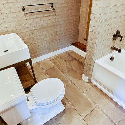Inspiration for a large contemporary kids' beige tile and subway tile porcelain tile bathroom remodel in Philadelphia with an undermount sink, a one-piece toilet, yellow walls and furniture-like cabinets