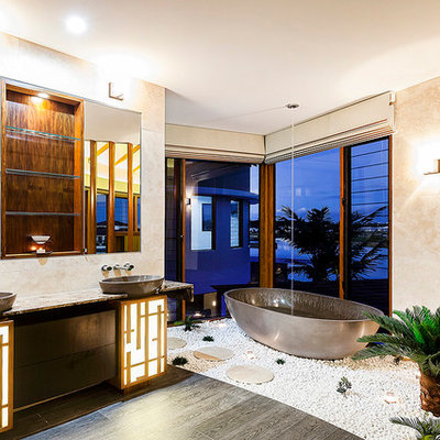 Freestanding bathtub - contemporary freestanding bathtub idea in Los Angeles with a vessel sink