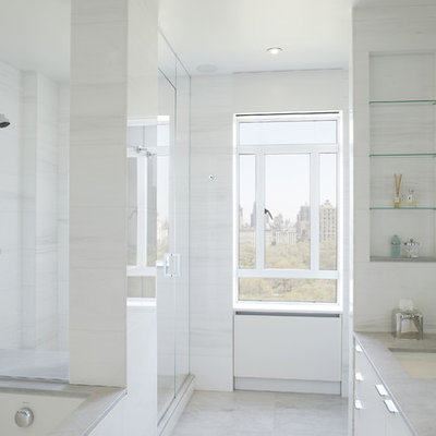 Bathroom - contemporary white tile and stone slab bathroom idea in New York