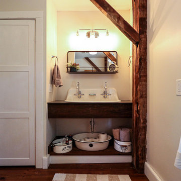 Century Home Bathroom with Farmhouse Sink and Tiled Bathtub