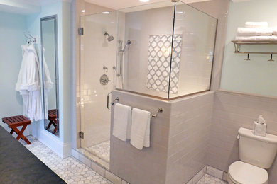 Corner shower - mid-sized traditional master gray tile and subway tile porcelain tile and white floor corner shower idea in Cleveland with furniture-like cabinets, dark wood cabinets, a two-piece toilet, an undermount sink, granite countertops, green walls and a hinged shower door