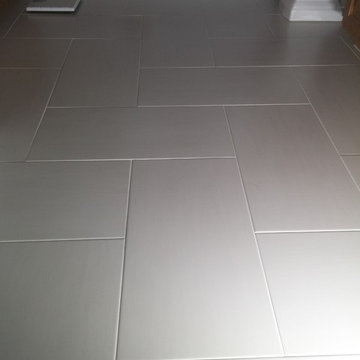 Ceramic Specialty Tile Shower with Herringbone Floor