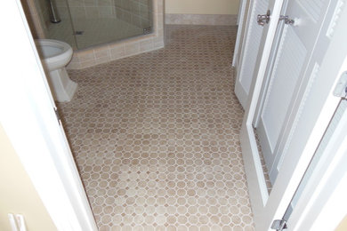 Example of a small classic beige tile ceramic tile corner shower design in Orange County