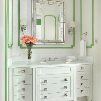 Example of a mid-sized classic mosaic tile floor and white floor bathroom design in St Louis with furniture-like cabinets, white cabinets, green walls, an undermount sink, marble countertops and white countertops