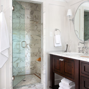 Inspiration for a timeless white tile alcove shower remodel in Denver with an undermount sink, dark wood cabinets and shaker cabinets