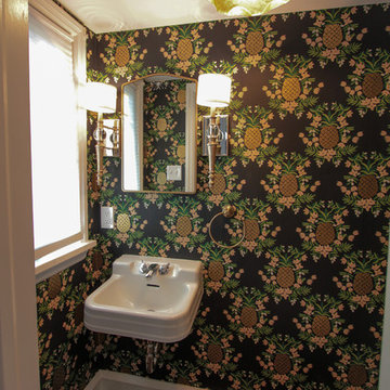 Champagne Bronze Fixtures and Bold Pineapple Wallpaper Power Room