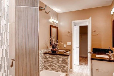 Design ideas for a medium sized classic ensuite bathroom in Phoenix with shaker cabinets, white cabinets, an alcove bath, a shower/bath combination, beige tiles, beige walls, light hardwood flooring and granite worktops.
