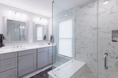 Example of a mid-sized minimalist master gray tile ceramic tile and white floor bathroom design in DC Metro with gray cabinets, a one-piece toilet, gray walls, quartzite countertops and white countertops