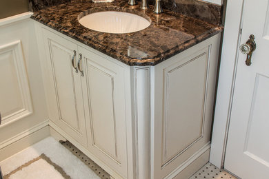 This is an example of a classic bathroom in New York with freestanding cabinets, beige cabinets and marble worktops.