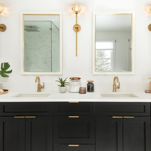 Bathroom - scandinavian bathroom idea in Denver with shaker cabinets, black cabinets, white walls, an undermount sink and white countertops