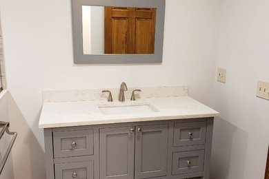 Large minimalist master bathroom photo in Bridgeport with shaker cabinets, gray cabinets, quartz countertops and white countertops