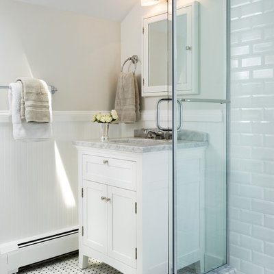 Inspiration for a timeless mosaic tile and black and white tile bathroom remodel in DC Metro with marble countertops