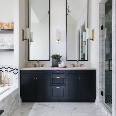 Bathroom - country white tile white floor bathroom idea in Chicago with recessed-panel cabinets, black cabinets, white walls, an undermount sink, a hinged shower door and white countertops