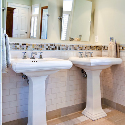 Example of a trendy white tile and subway tile bathroom design in Atlanta with a pedestal sink