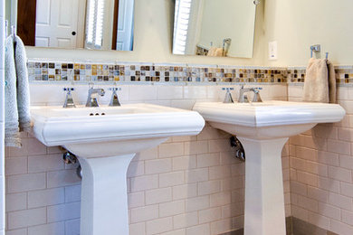 Example of a trendy white tile and subway tile bathroom design in Atlanta with a pedestal sink