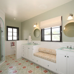 Photo of a traditional bathroom in Los Angeles with subway tile, tile benchtops and green benchtops.