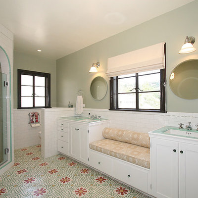 Example of a classic subway tile bathroom design in Los Angeles with tile countertops and green countertops